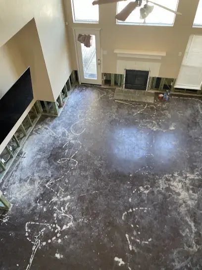 Concrete slab exposed after wet flooring was pulled and walls were flood cut